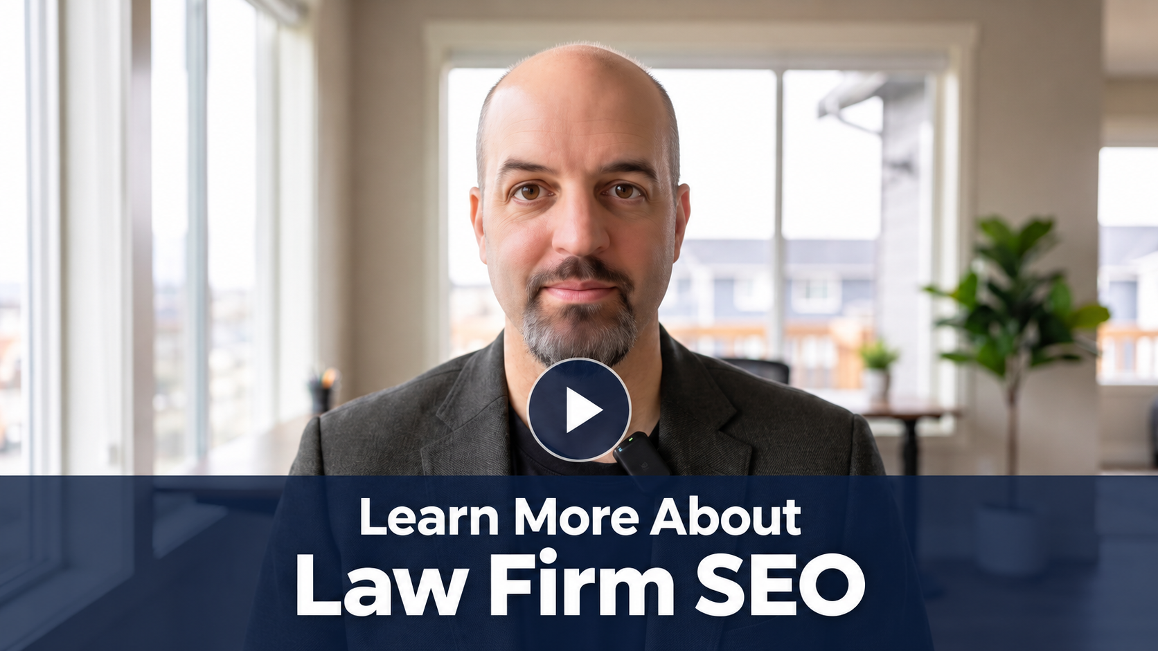 Video thumbnail: man in a blazer in an office with a blue banner reading 'Learn More About Law Firm SEO' and a Play button in the center.
