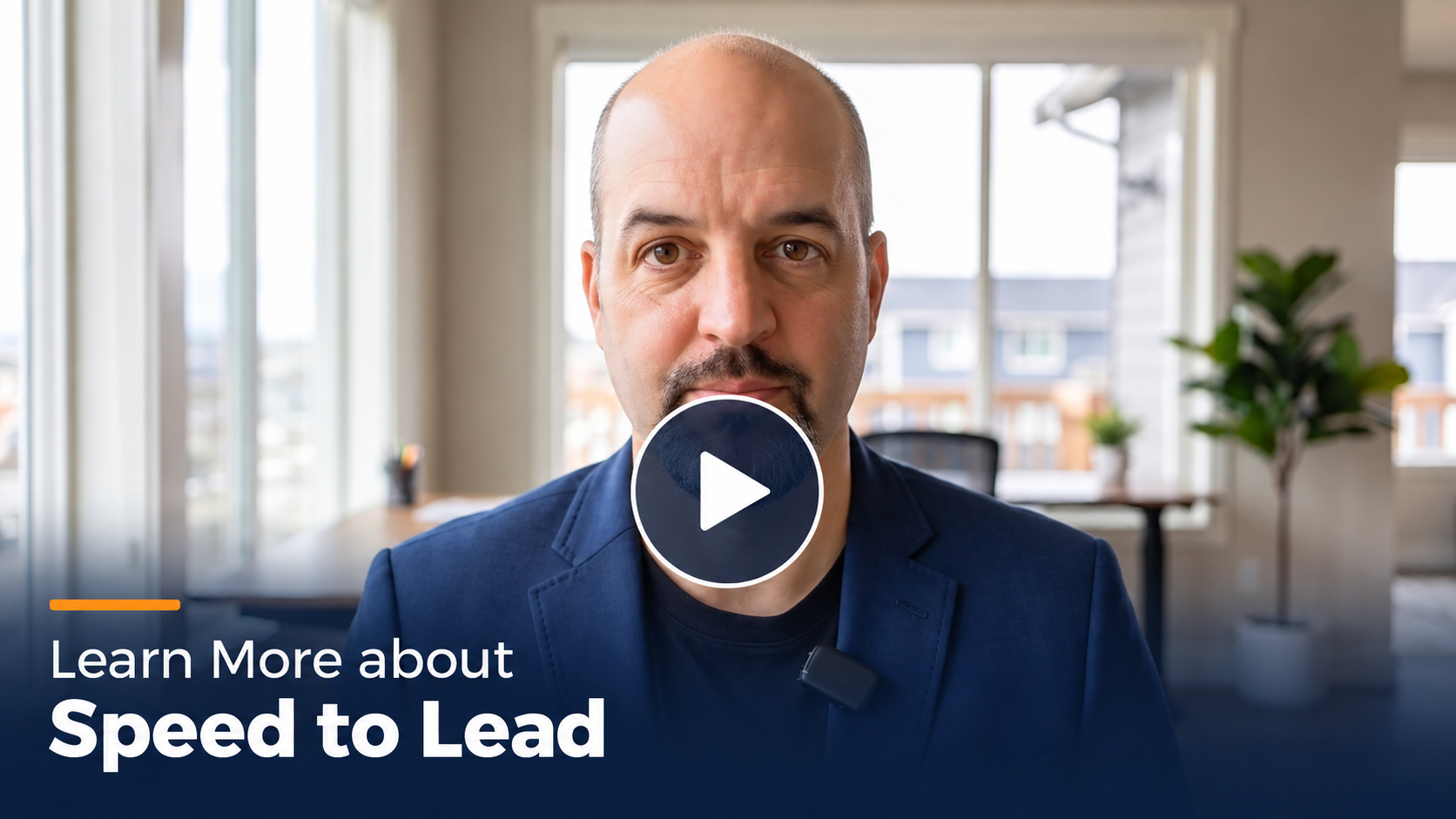 Video thumbnail: man in a blue blazer in a bright office, with a play button centered over his face and the text 'Learn More about Speed to Lead' shown at the bottom-left.